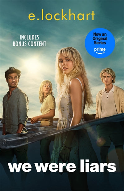 We Were Liars print book cover by e lockhart showing four young adults on an island beach with ocean reflections